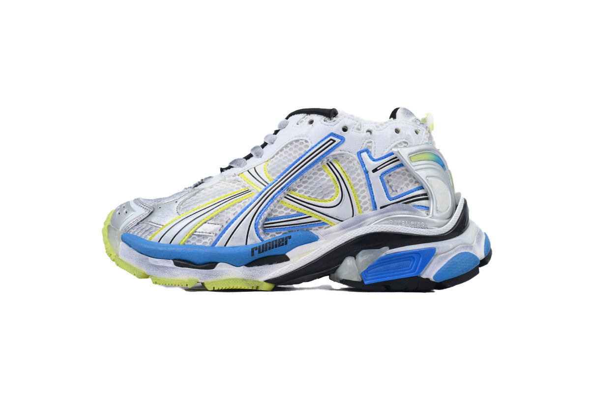 White athletic shoe with blue and yellow accents on a white background