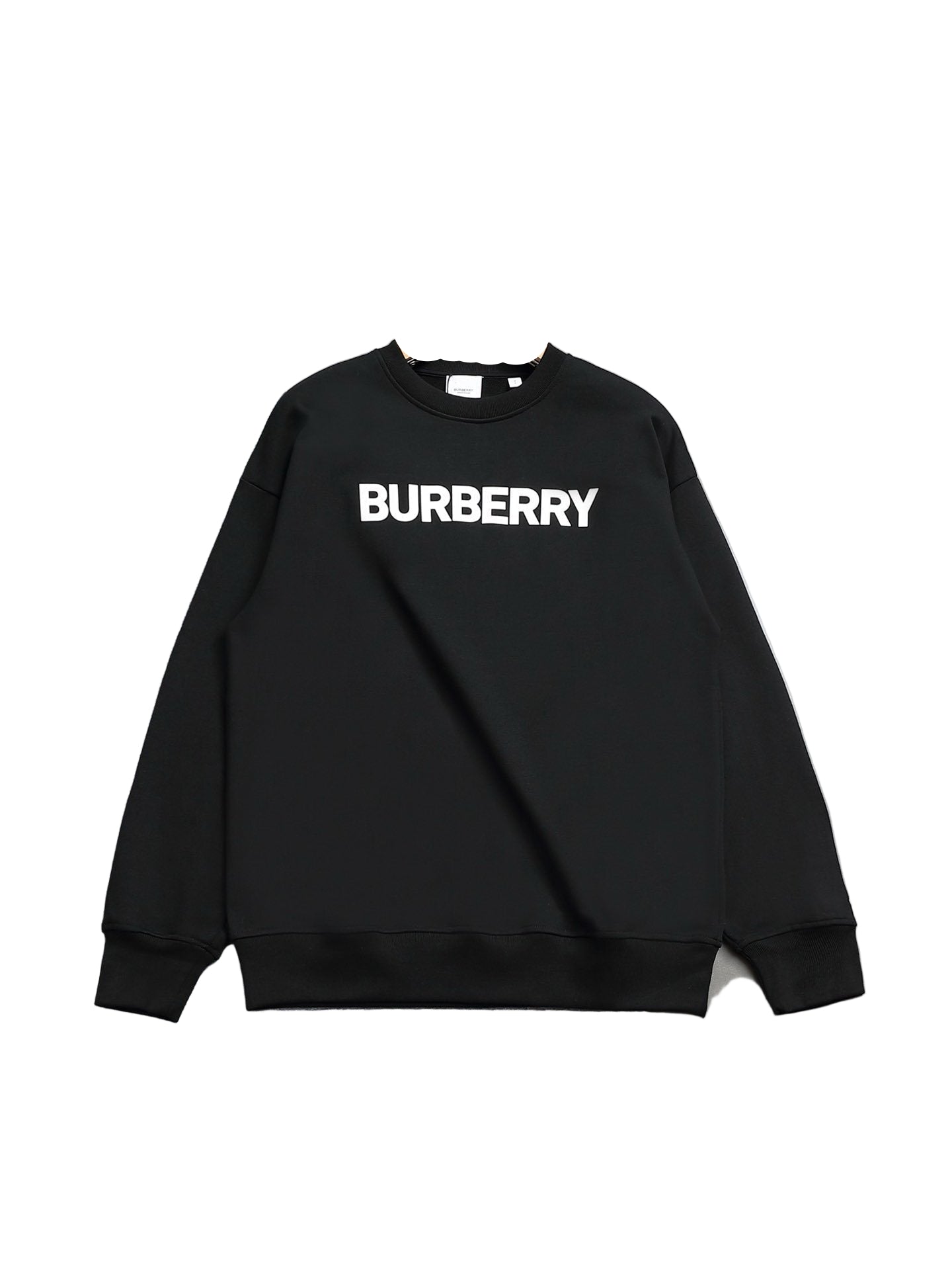Black sweatshirt on a hanger against a gray background