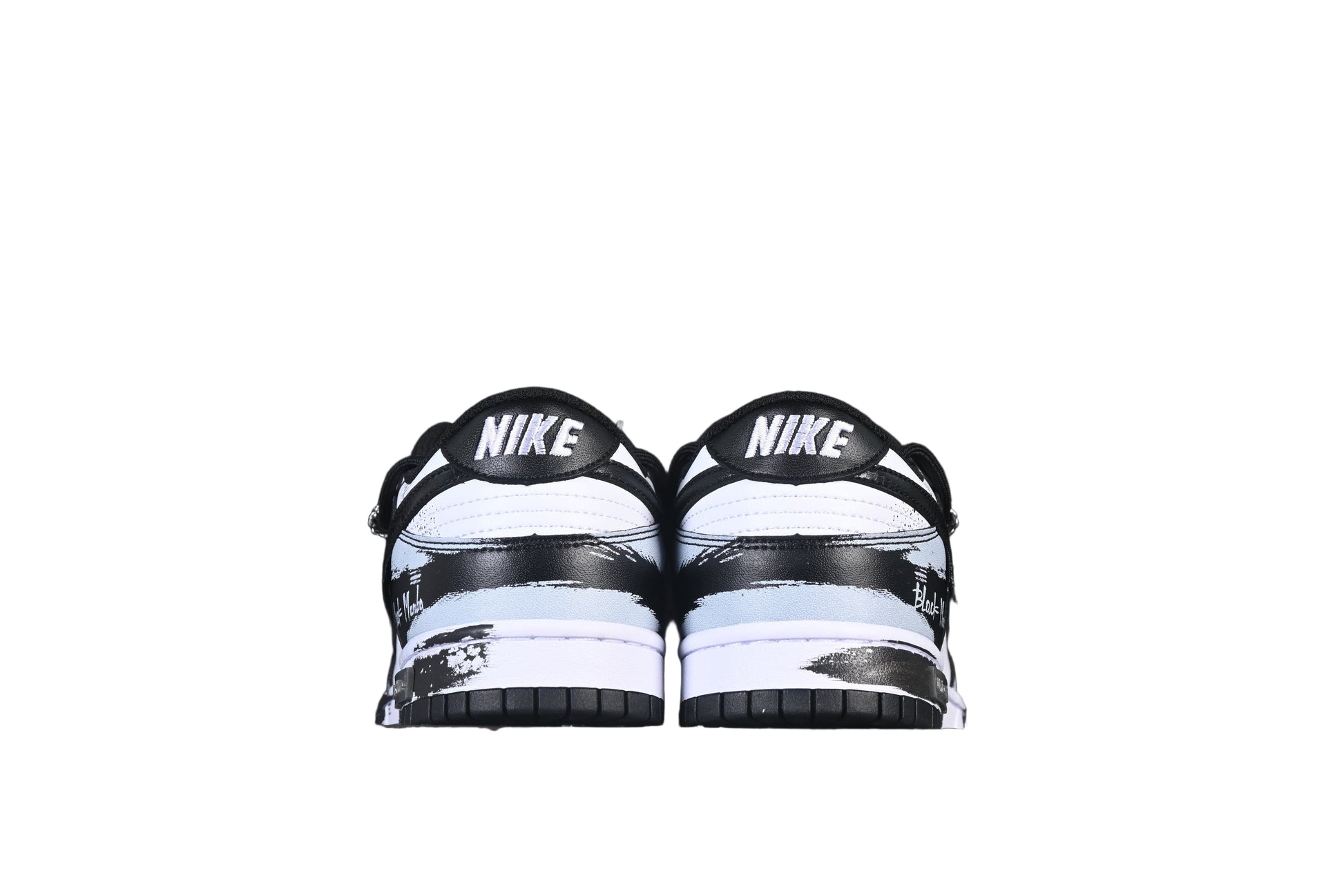 Black and white shoes on a black background