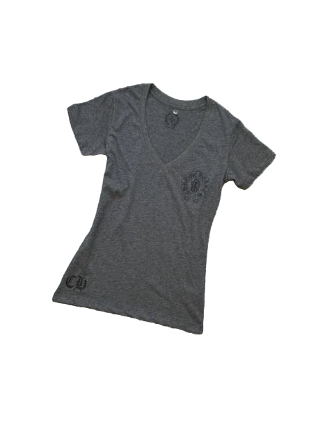 Gray t-shirt with a  graphic on a textured gray surface