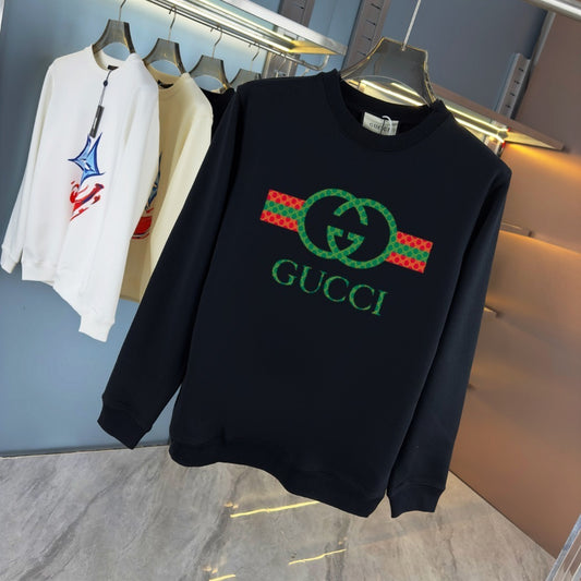 Black sweatshirt with graphic on a hanger against a store background