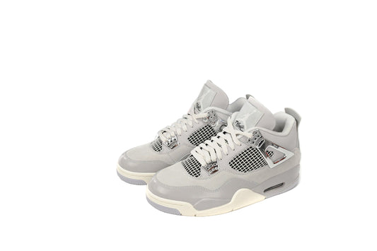 Gray sneakers with white soles next to a black box featuring a red graphic on a white background