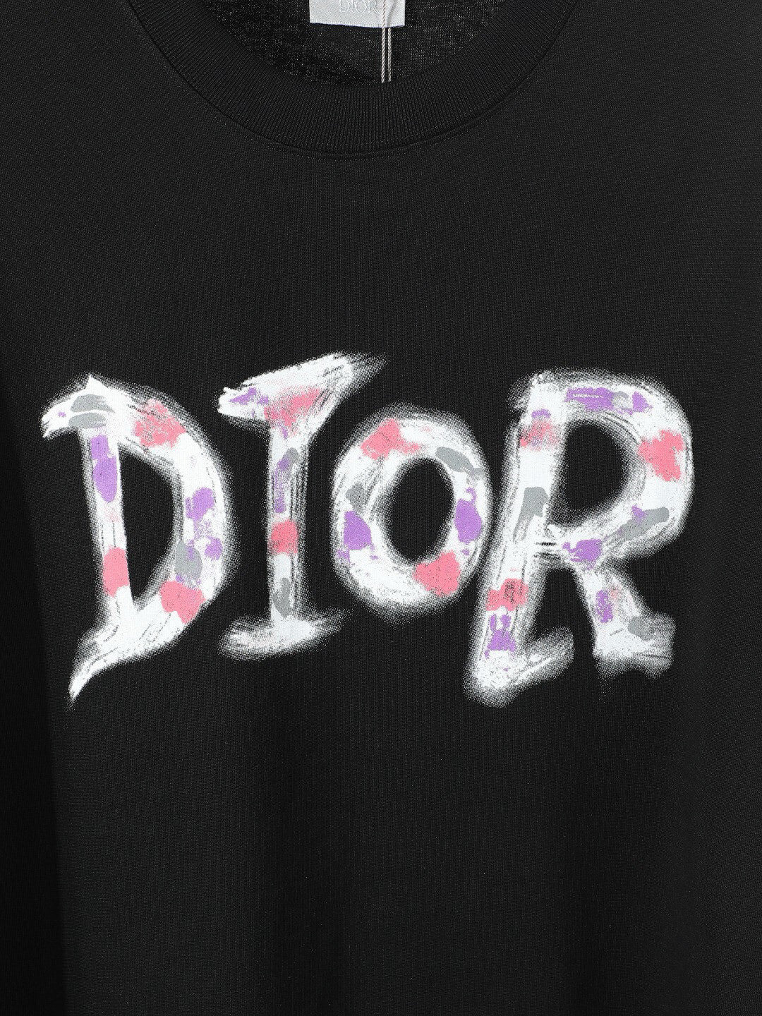 Black or White Distressed Letter Graphic T-Shirt with Color Accents