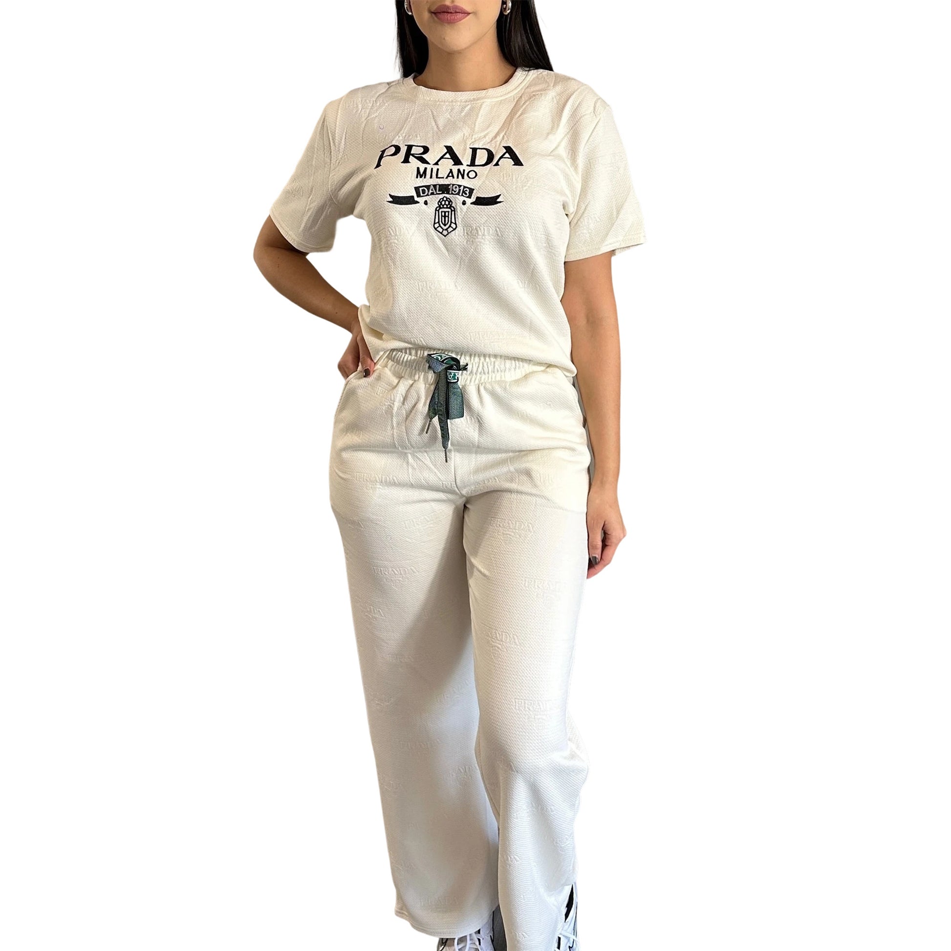 Person wearing a beige  t-shirt and pants on a white background