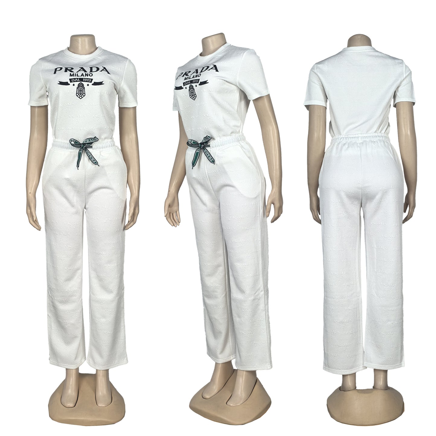 White outfit with greaphic on a mannequin against a white background