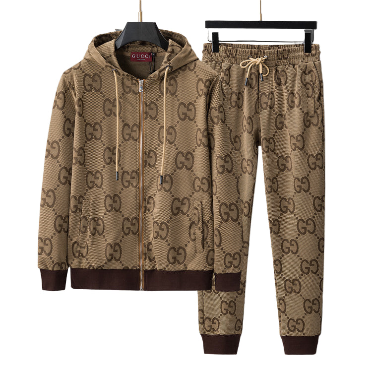 Beige tracksuit with graphic on hangers against a gray background