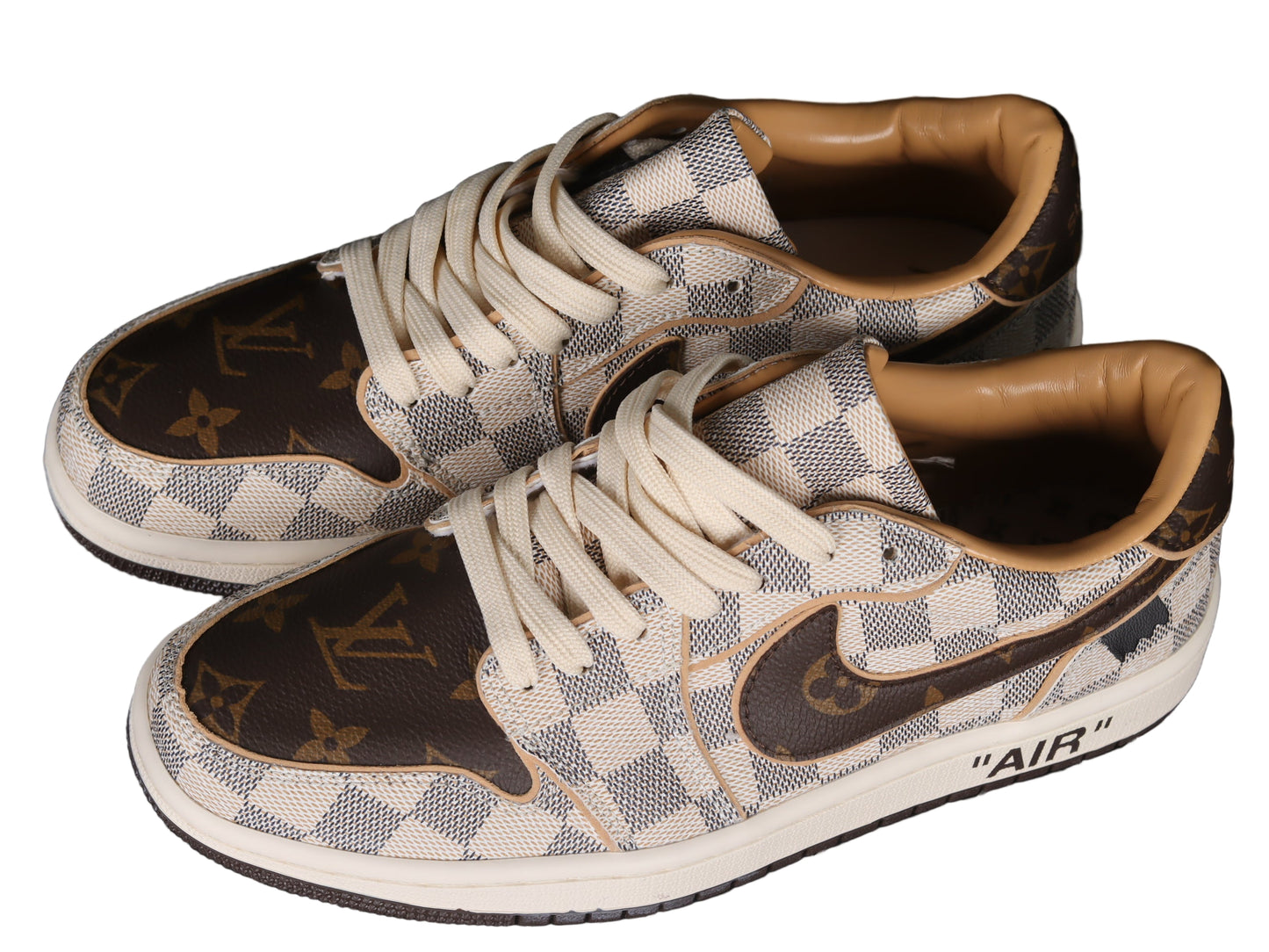 Pair of sneakers with checkered pattern and visible graphic on a black grid background