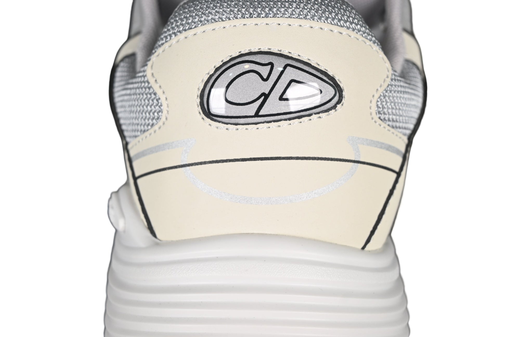 Close-up of a sneaker with a graphicon the side against a black background