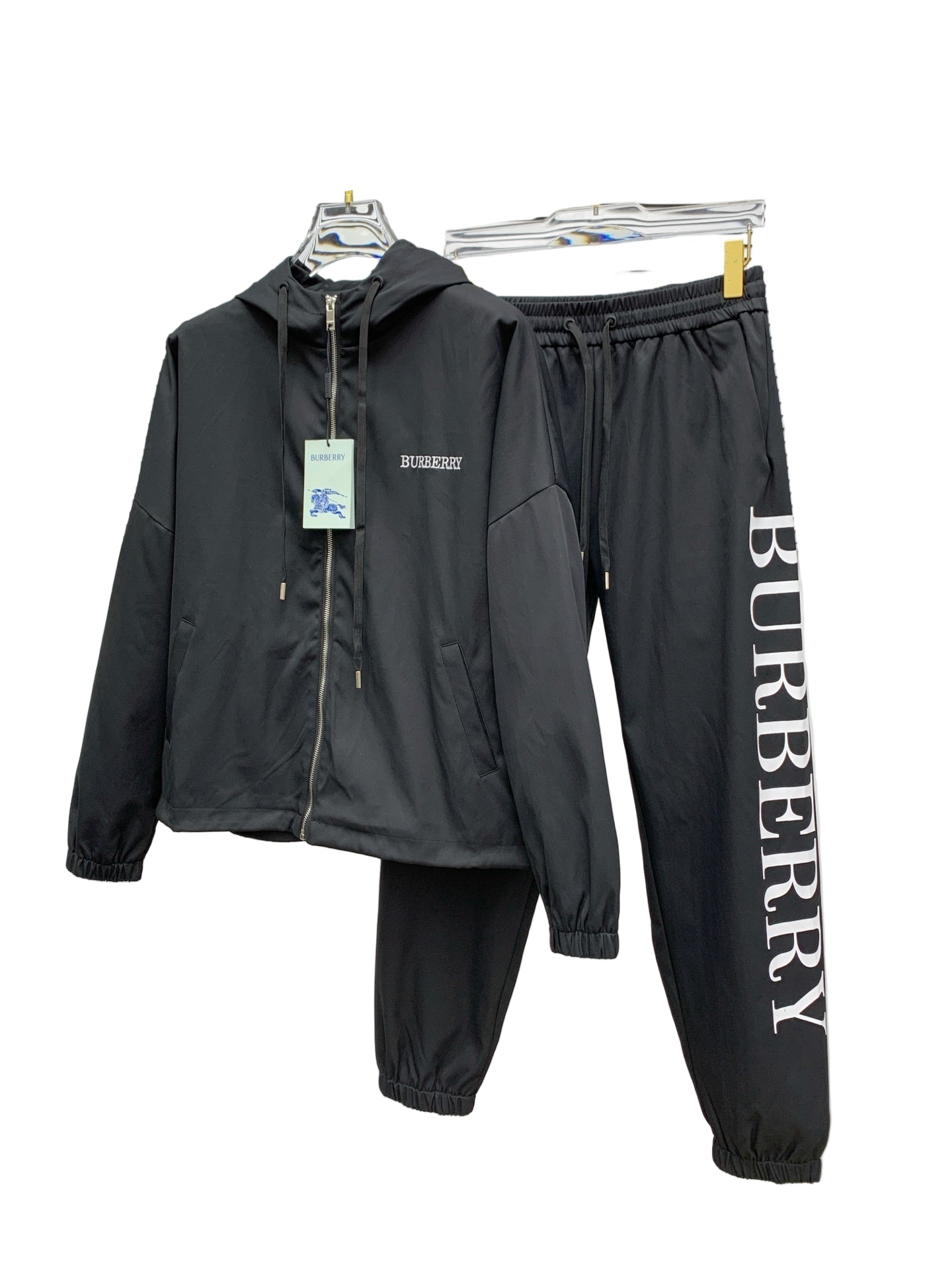 Black  tracksuit with jacket and pants on a white background