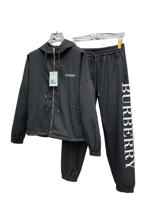 Black  tracksuit with jacket and pants on a white background