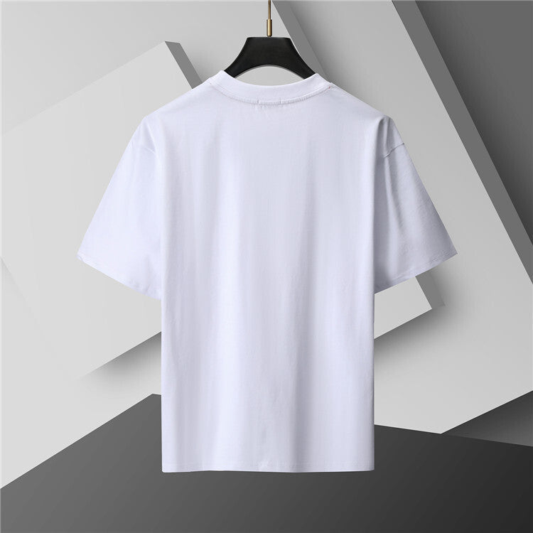 White t-shirt on a black hanger against a geometric gray background