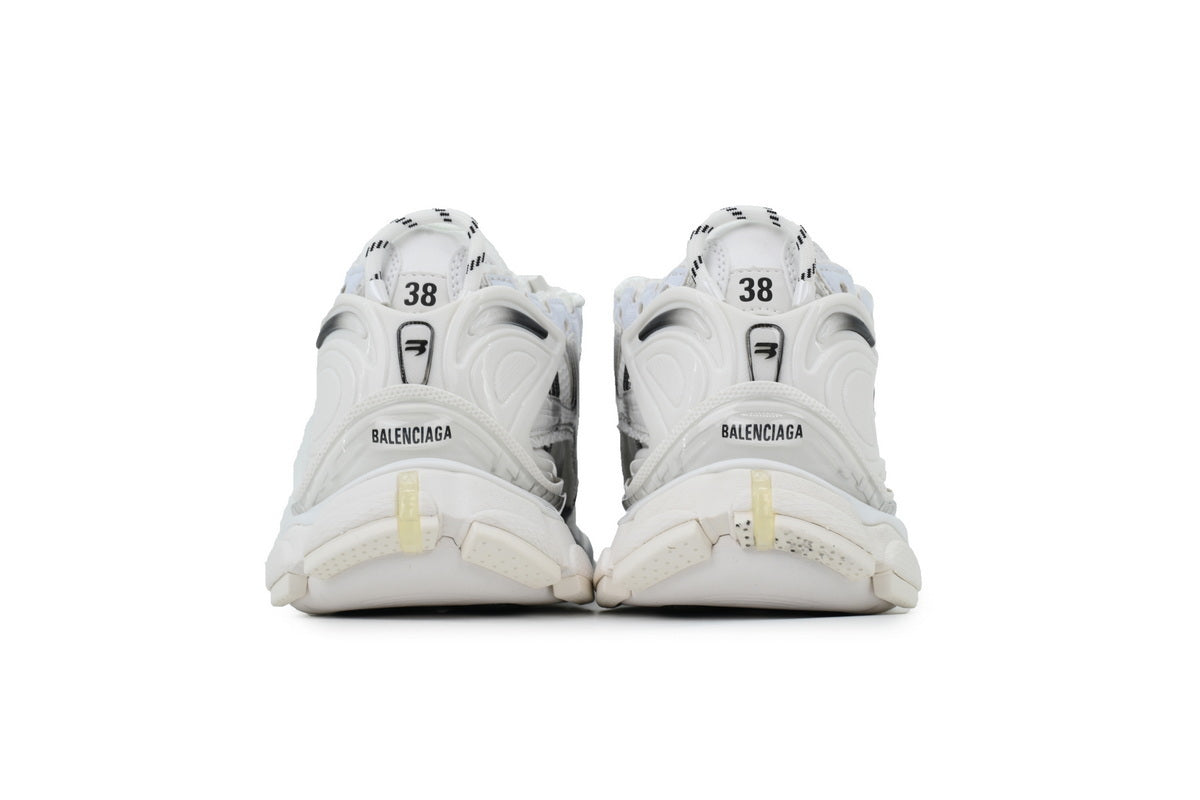 White  sneakers with brand logo on a white background
