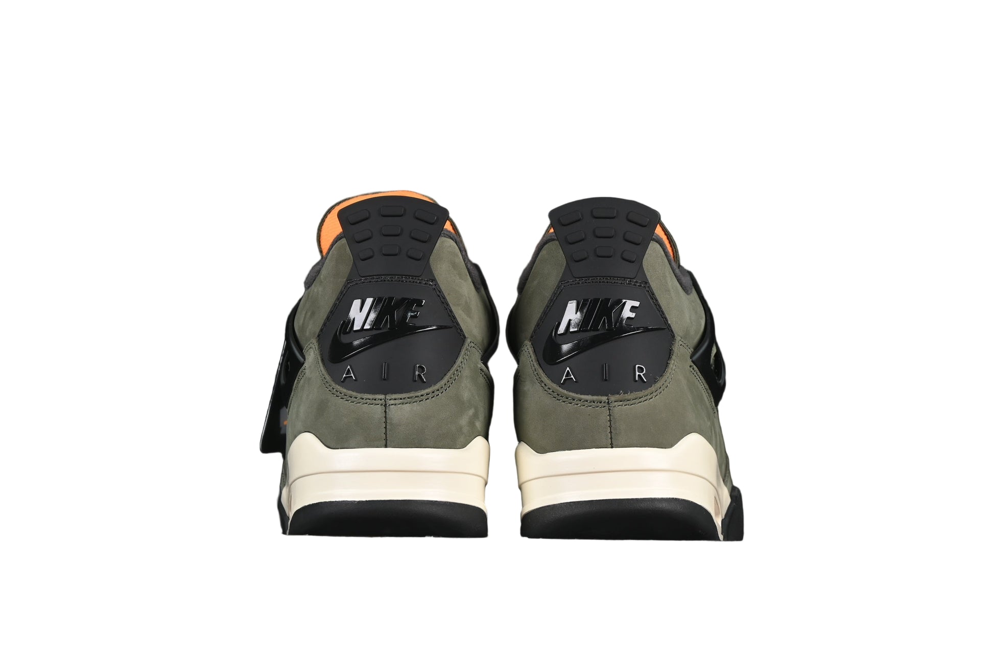 Two green shoes on a black background