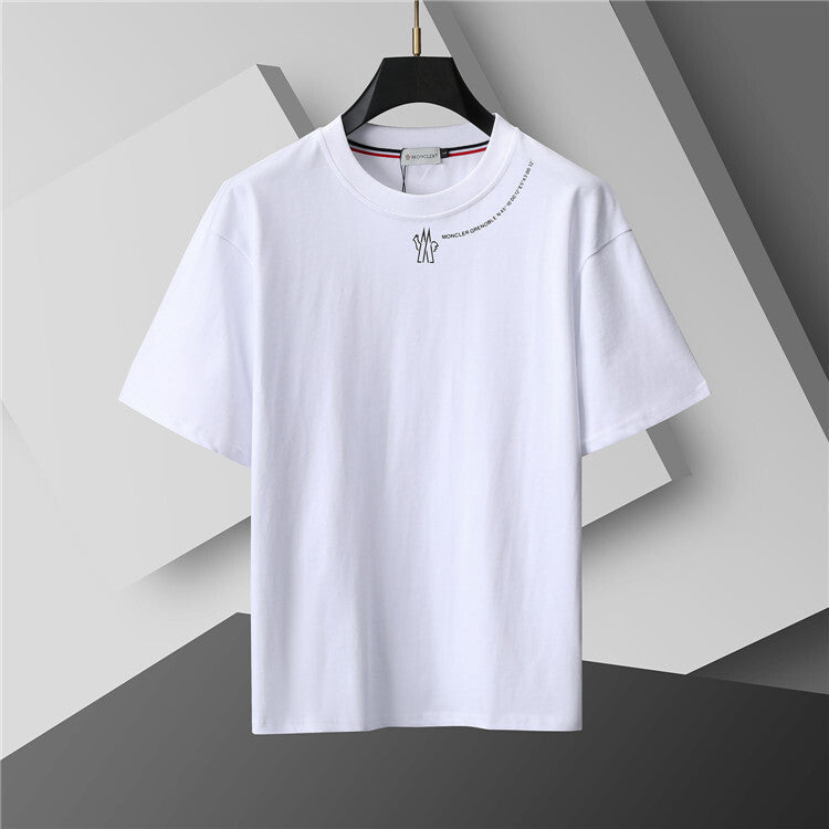 White t-shirt with a small design on a gray background