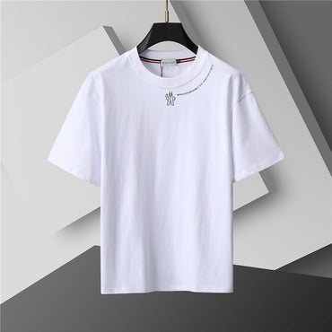 White t-shirt with a small design on a gray background