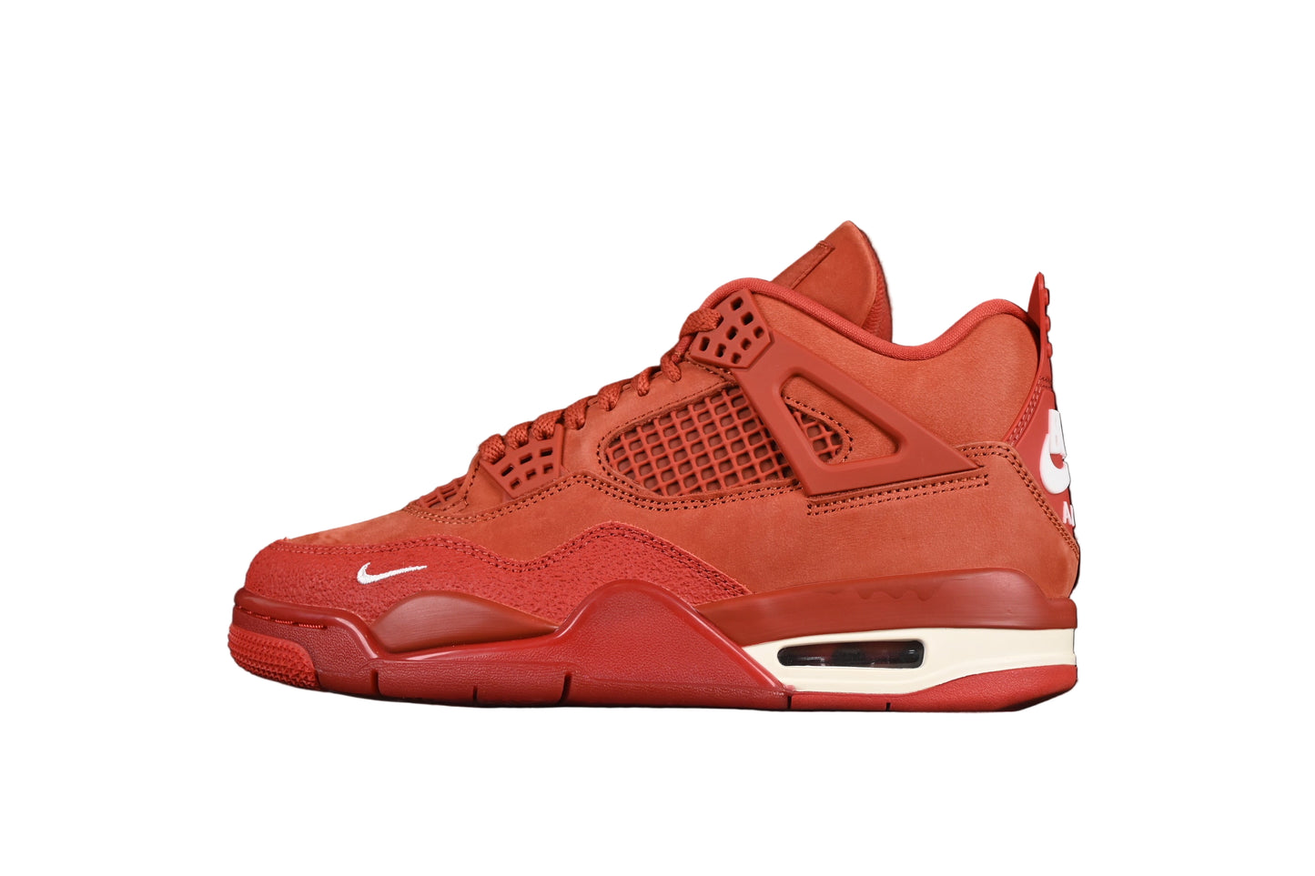 Red sneaker with white accents on a black background