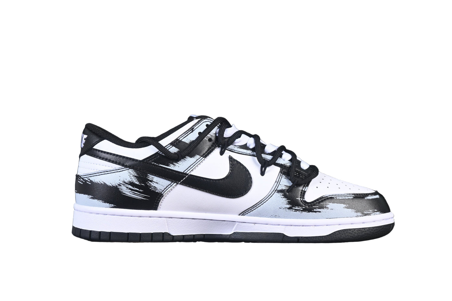 Black and white sneaker with a prominent on a black background