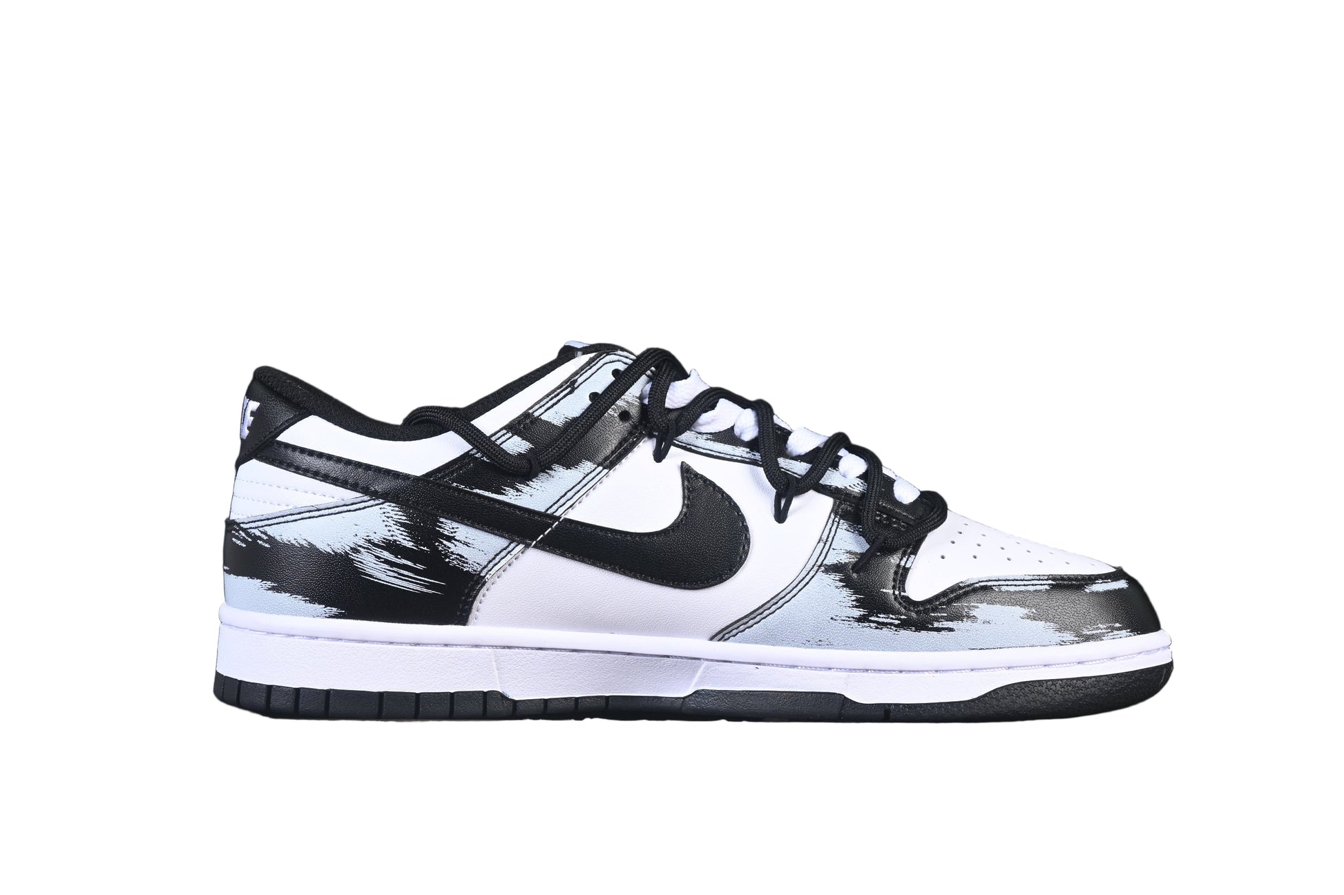 Black and white sneaker with a prominent on a black background