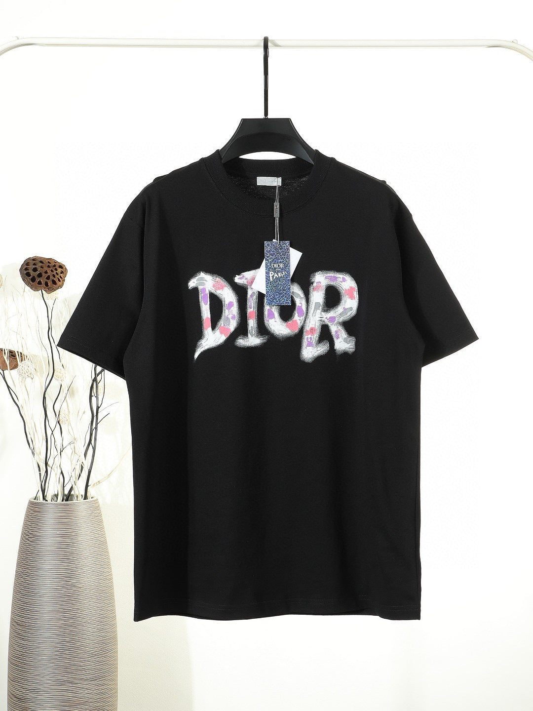 Black or White Distressed Letter Graphic T-Shirt with Color Accents