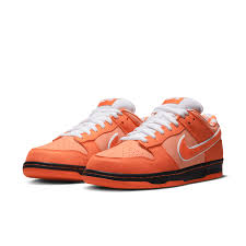 Orange sneakers with white  on a white background
