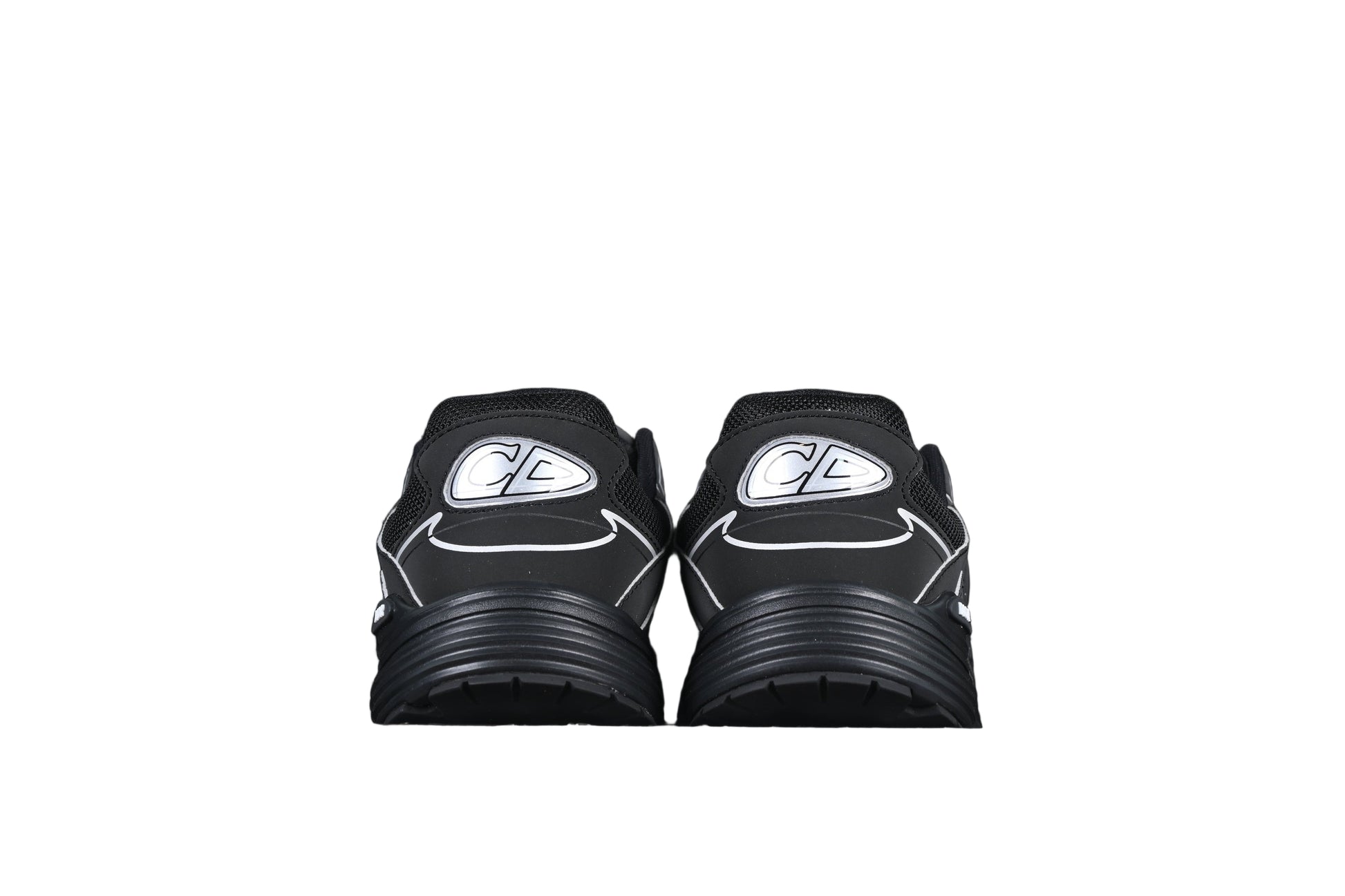 Black sneakers with silver on a black background