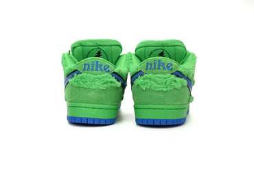 Green sneakers with blue accents on a white background