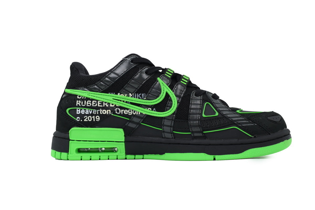 Black and green sneaker with visible graphic on a white background