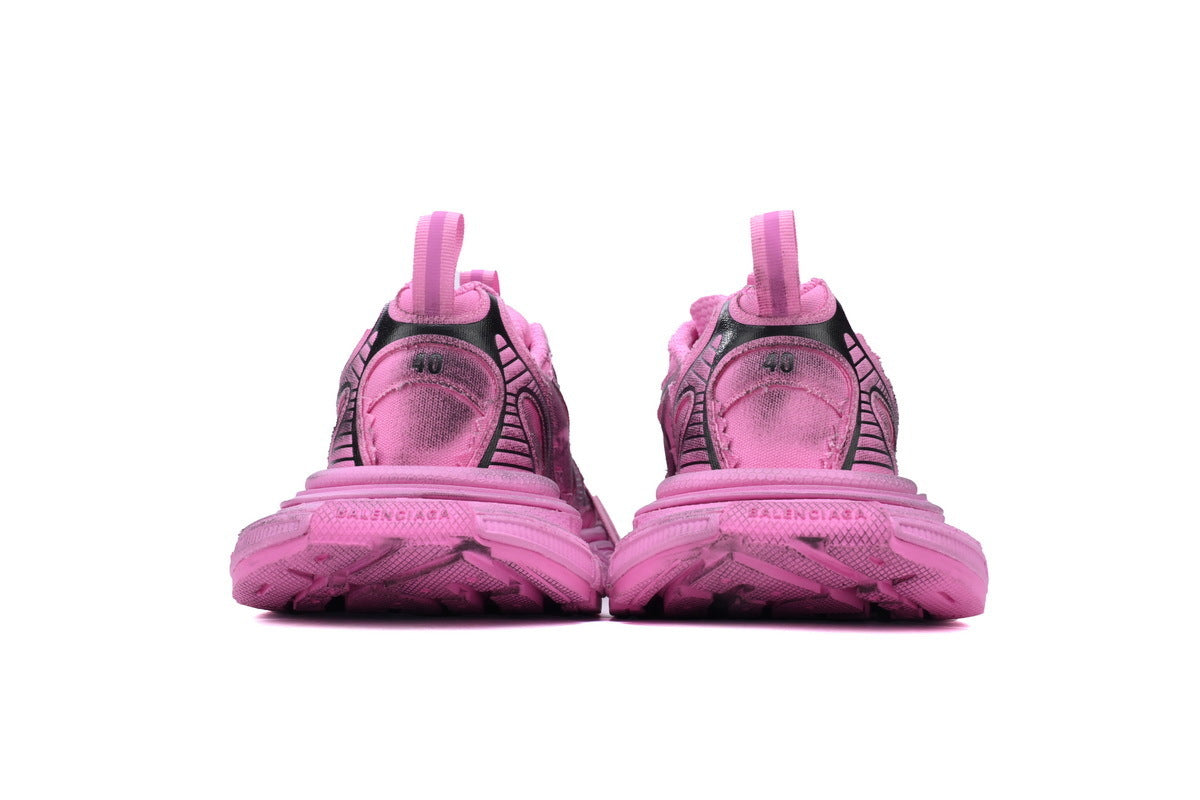 Pink and black sneakers on a white background