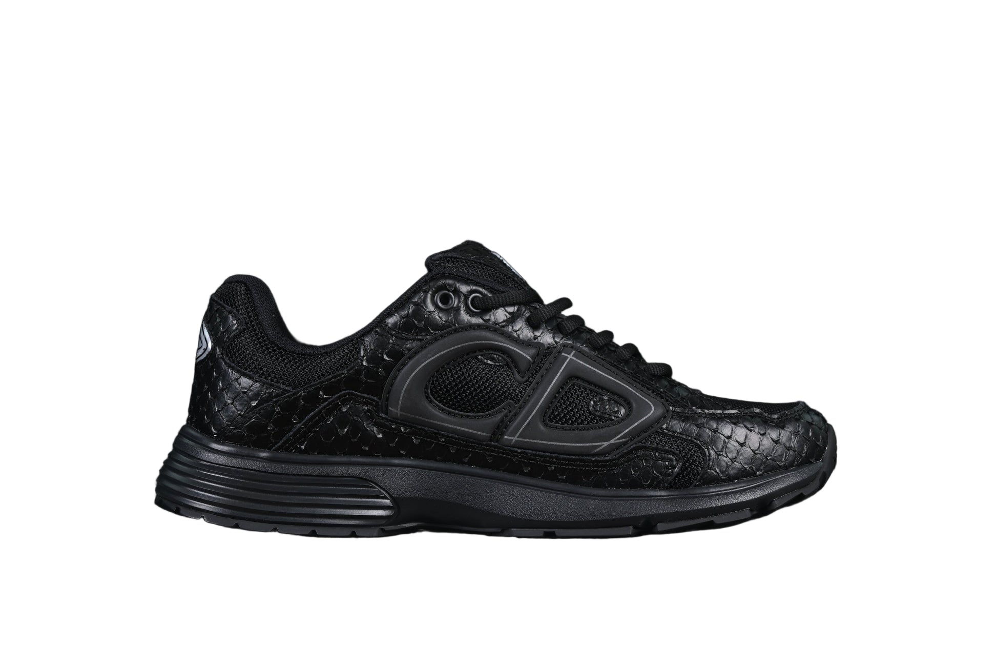 Black athletic shoe on a black background