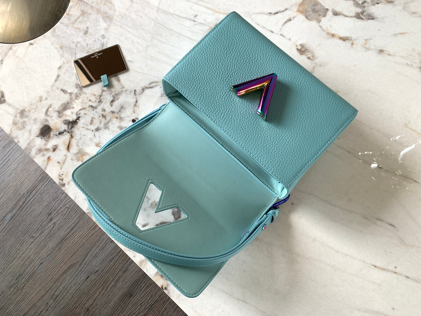 open Summer Splash Twist MM bag  iridescent blue grained calfskin leather